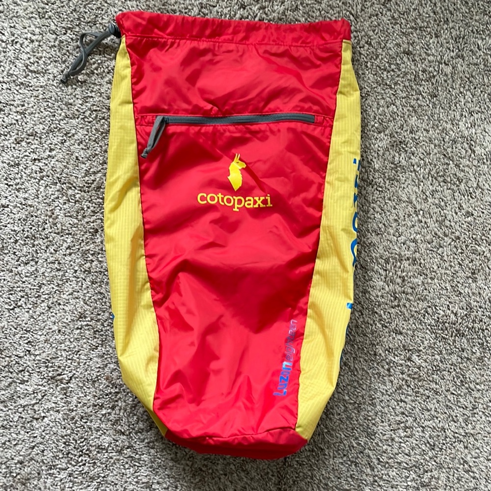 Cotopaxi Luzon 18L del dia backpack featuring Filipino Sun detail